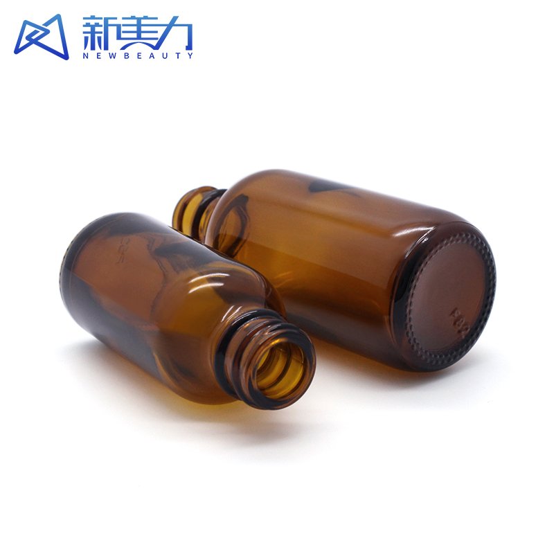 Custom 15ml 30ml 60ml thick bottom cosmetic amber boston round glass bottle amber glass shampoo bottles