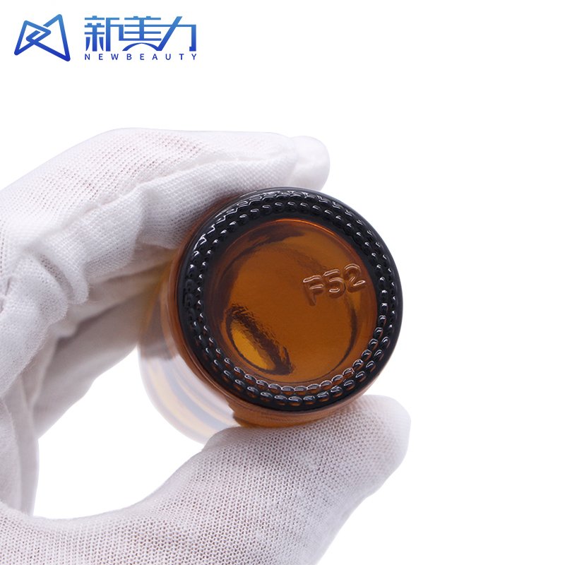 Custom 15ml 30ml 60ml thick bottom cosmetic amber boston round glass bottle amber glass shampoo bottles