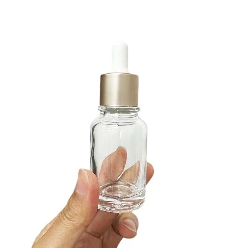 The manufacturer's creative cash payment 30ml ring can separately bottled glass bottle containing essence camellia oil dropper