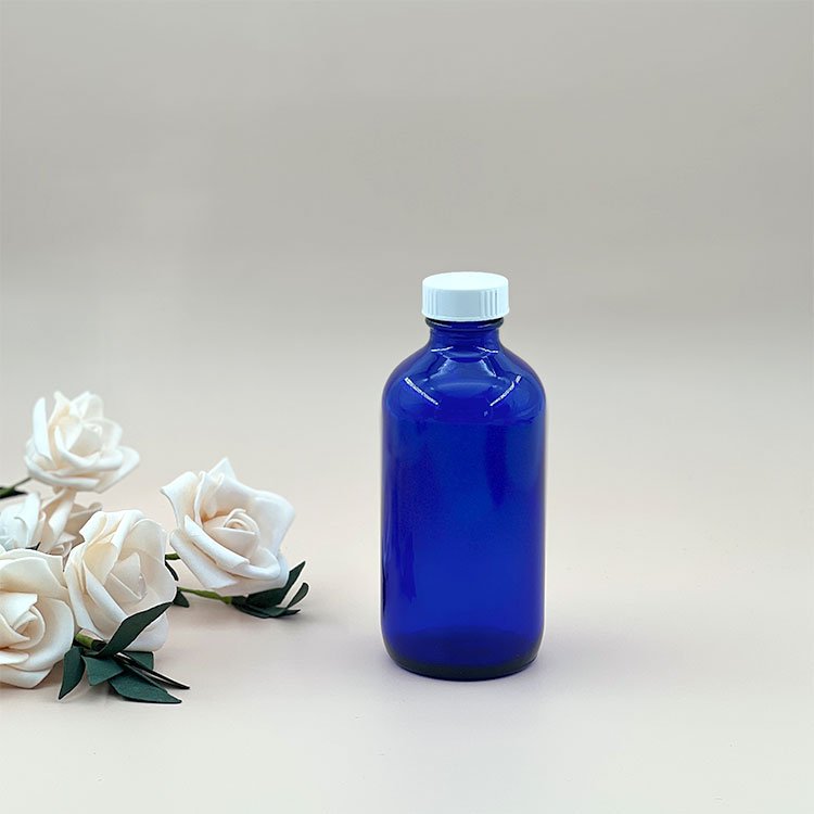 New Trend 8 oz Clear Blue Boston Bottle Custom Logo Amber Glass Screw Bottle with Bakelite Cap for Essential Oils Serums Creams