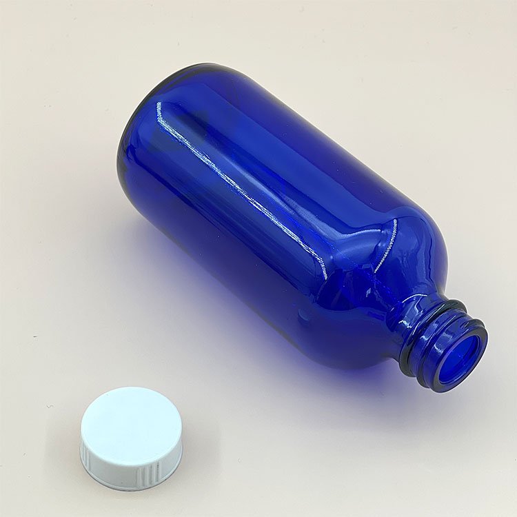 New Trend 8 oz Clear Blue Boston Bottle Custom Logo Amber Glass Screw Bottle with Bakelite Cap for Essential Oils Serums Creams