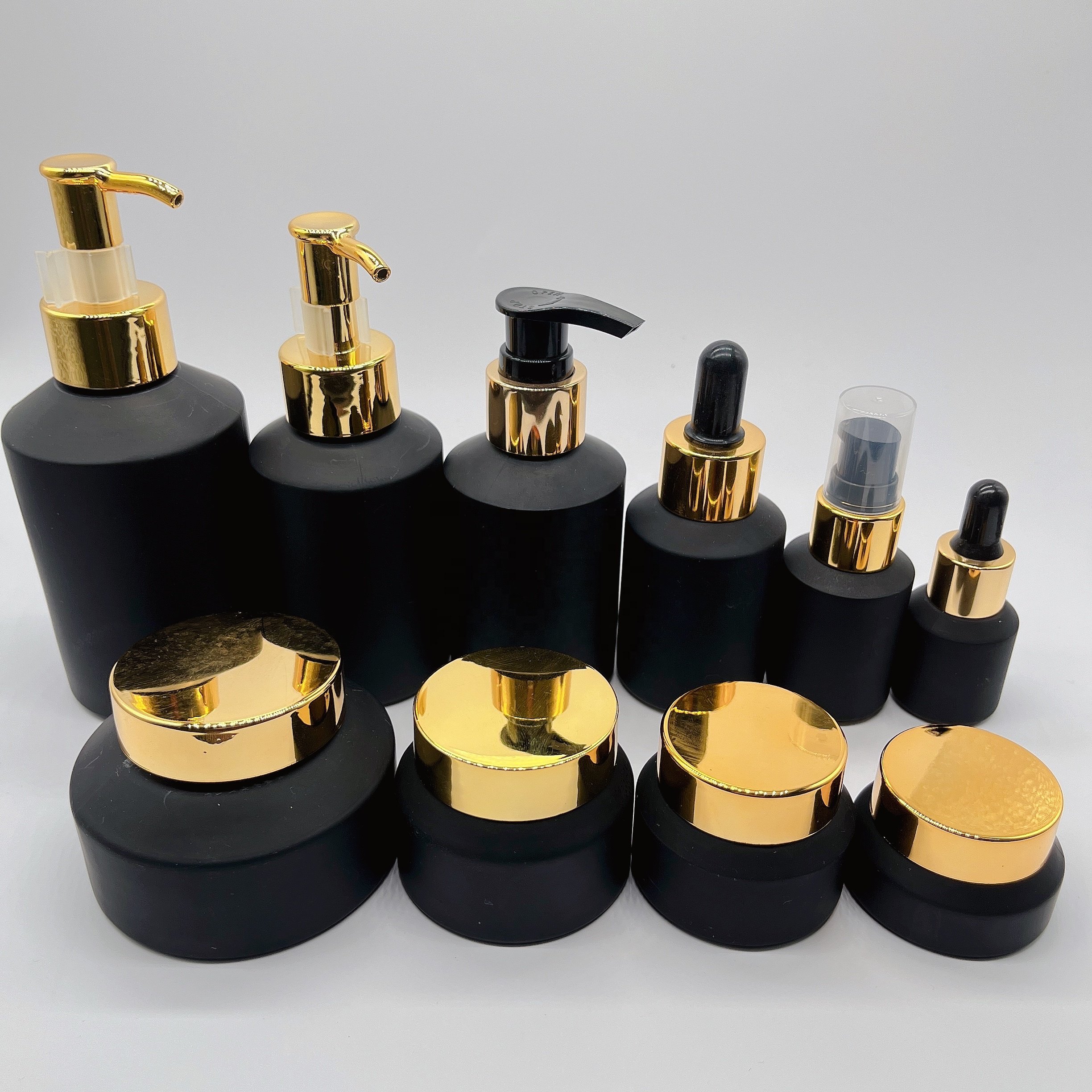 Cosmetic packaging 15ml-100g matte black slant shoulder glass bottle with gold lid/pump/dropper lotion bottle cream jar sets