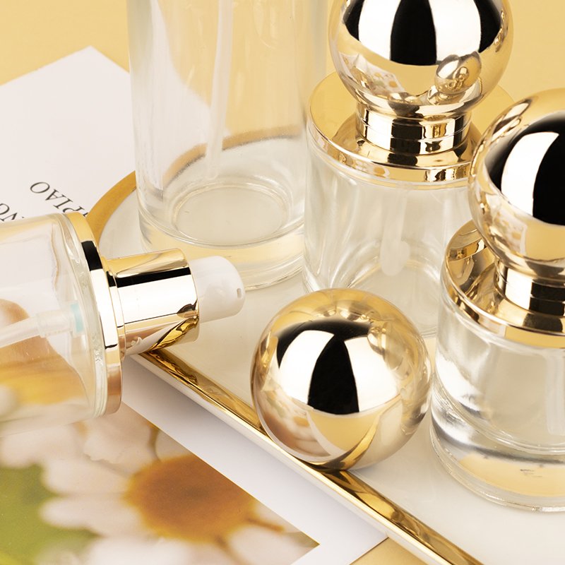 Ball shape glass cosmetic container 30ml/60ml/100ml/120ml/ pump lotion Essential Oil Glass jar with gold lid Glass bottle set