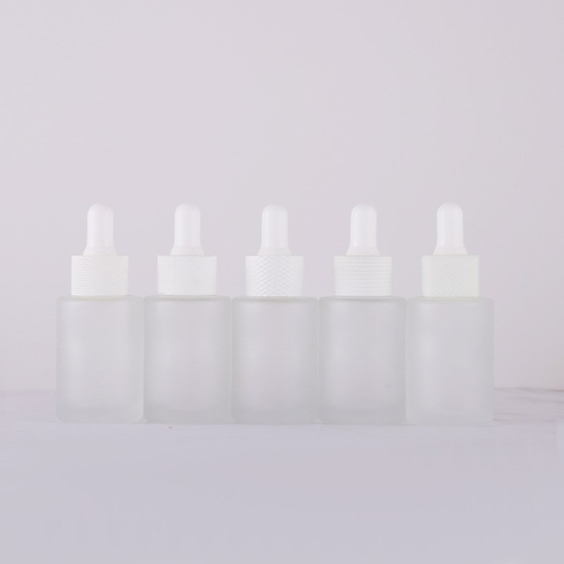 hot sale customized 30ml transparent frosted lotion cylinder essential oil dropper glass bottle with lid