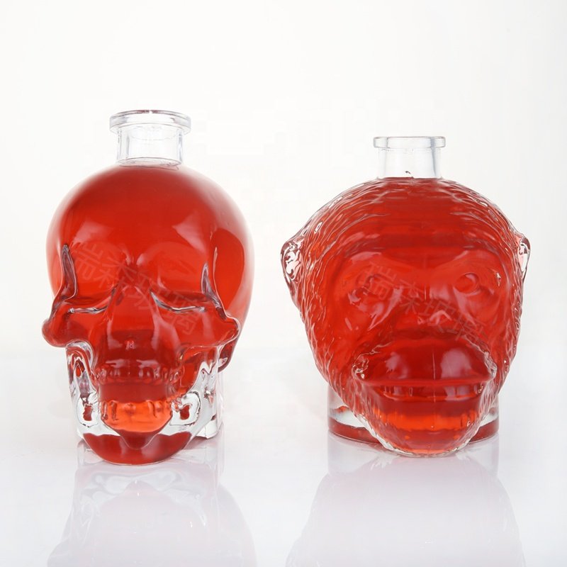Custom unique whisky glass bottles special shape glass skull liquor spirits bottle