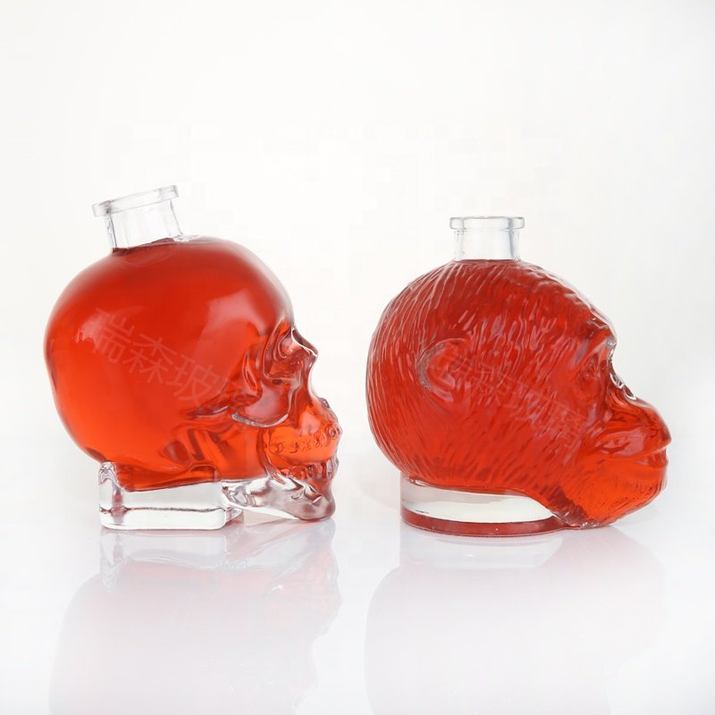Custom unique whisky glass bottles special shape glass skull liquor spirits bottle