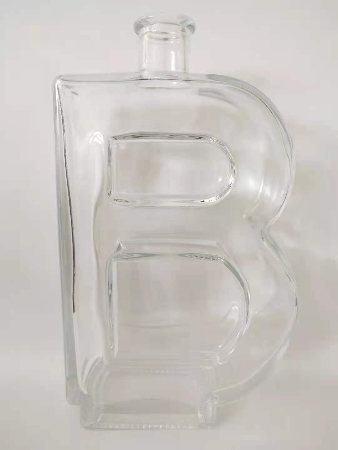 Wholesale price 580ml woman shape tequial bottle custom special shape 700ml 750ml vodka whiskey liquor glass bottle with cork