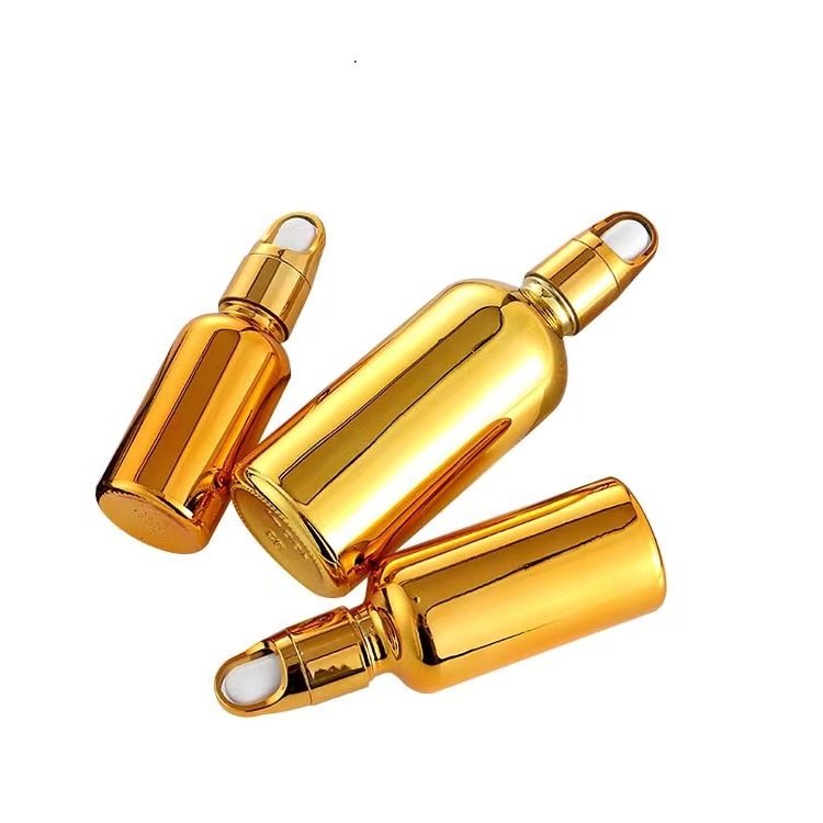 Custom Color UV Gold Essential Oil Bottle 20ml 30ml 50ml Small Gold Bottle Cosmetics Glass Bottle with Gold Lid