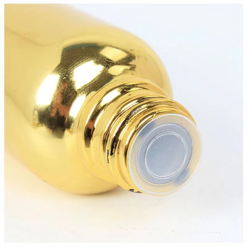 Custom Color UV Gold Essential Oil Bottle 20ml 30ml 50ml Small Gold Bottle Cosmetics Glass Bottle with Gold Lid