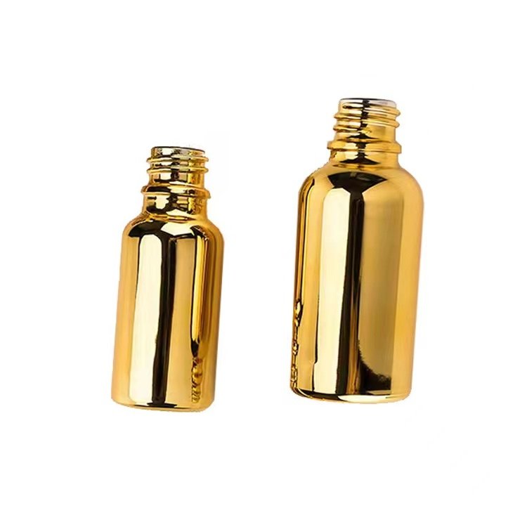 Custom Color UV Gold Essential Oil Bottle 20ml 30ml 50ml Small Gold Bottle Cosmetics Glass Bottle with Gold Lid