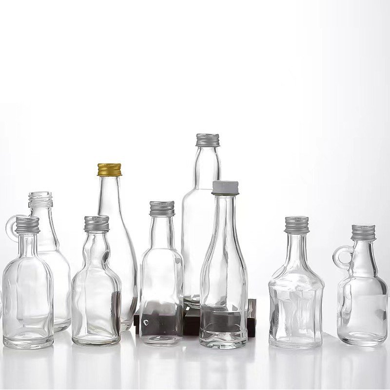 China supply chain Mini glass liquor bottles 50ml customise wine glass bottle 2.5oz glass bottles with screw caps