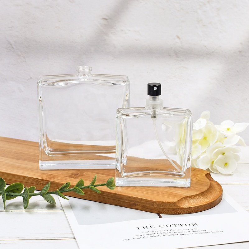Factory direct sale 50ml 100ml luxury empty transparent square cosmetic bottle perfume glass bottle with pump sprayer