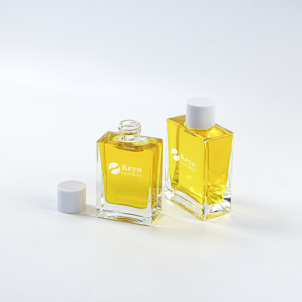 Hot sale Square rectangular 30 50Ml 100Ml Empty clear hair Oil face oil skincare Glass Bottle with white screw cap