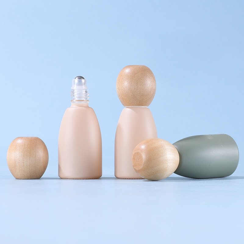 wood Ball cap Morandi color empty refillable glass bottle with metal roller ball roll on bottle 10ml essential oil glass bottle