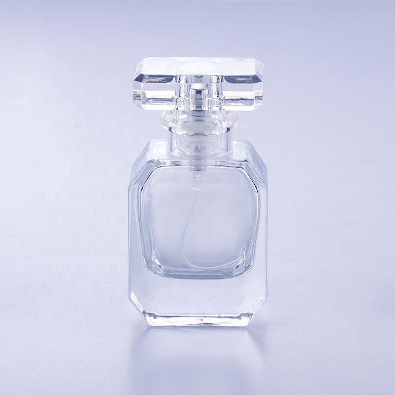 High quality empty transparent polyhedral flat crimp 50 ml glass perfume bottle
