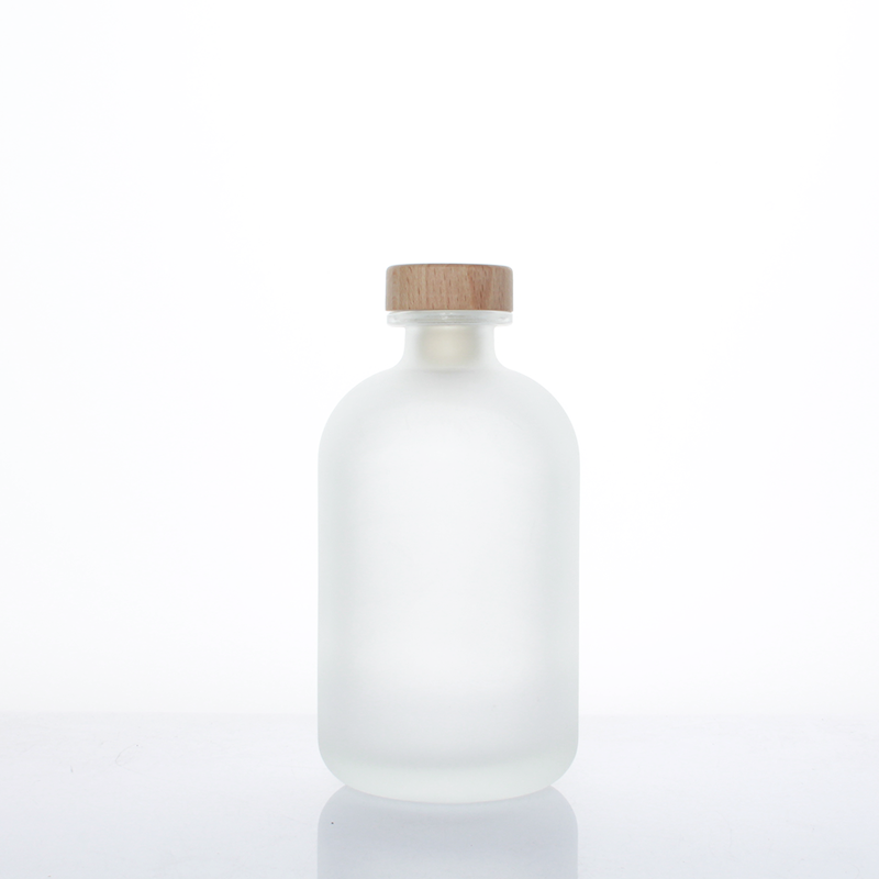 Wholesale high quality round beverage bottle juice glass bottle with lid wine bottle