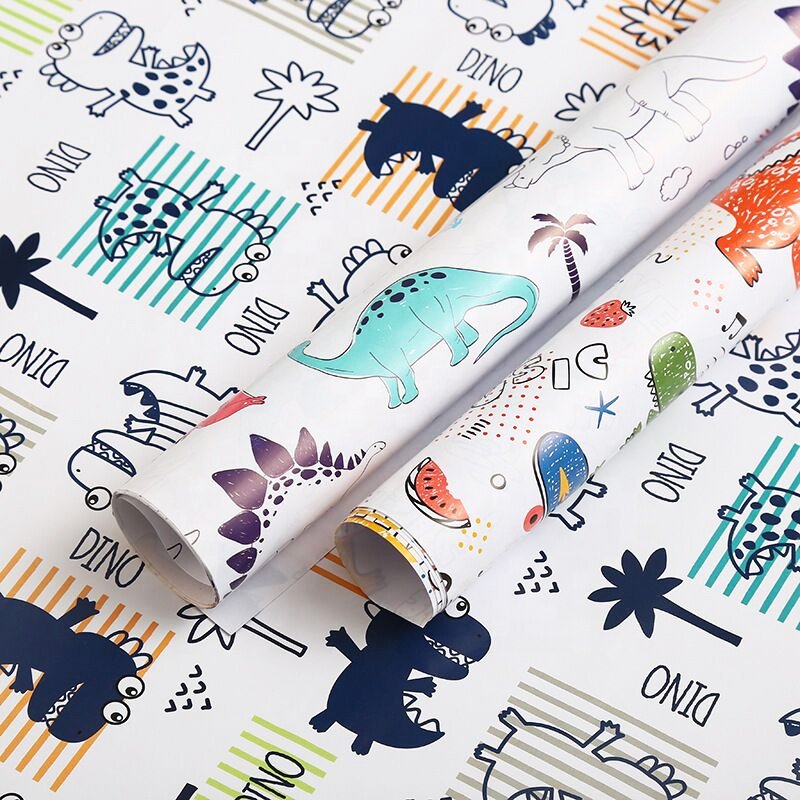 Wholesale Spot cheap spot 80 grams of coated paper boy dinosaur pattern gift paper 50x80cm