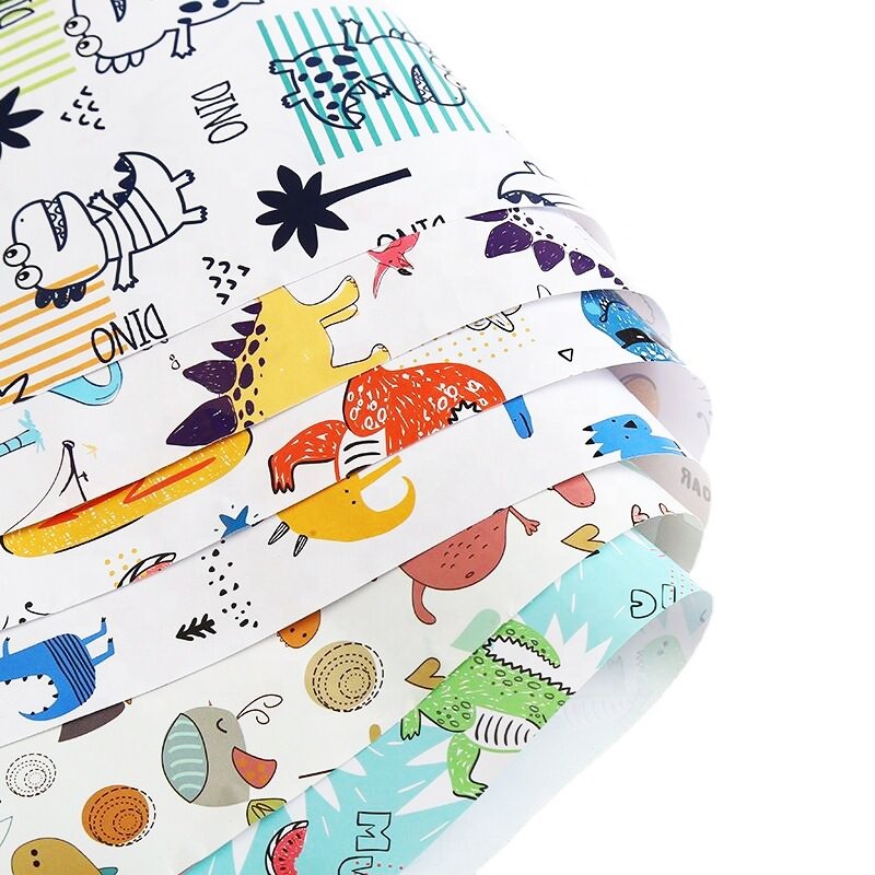 Wholesale Spot cheap spot 80 grams of coated paper boy dinosaur pattern gift paper 50x80cm