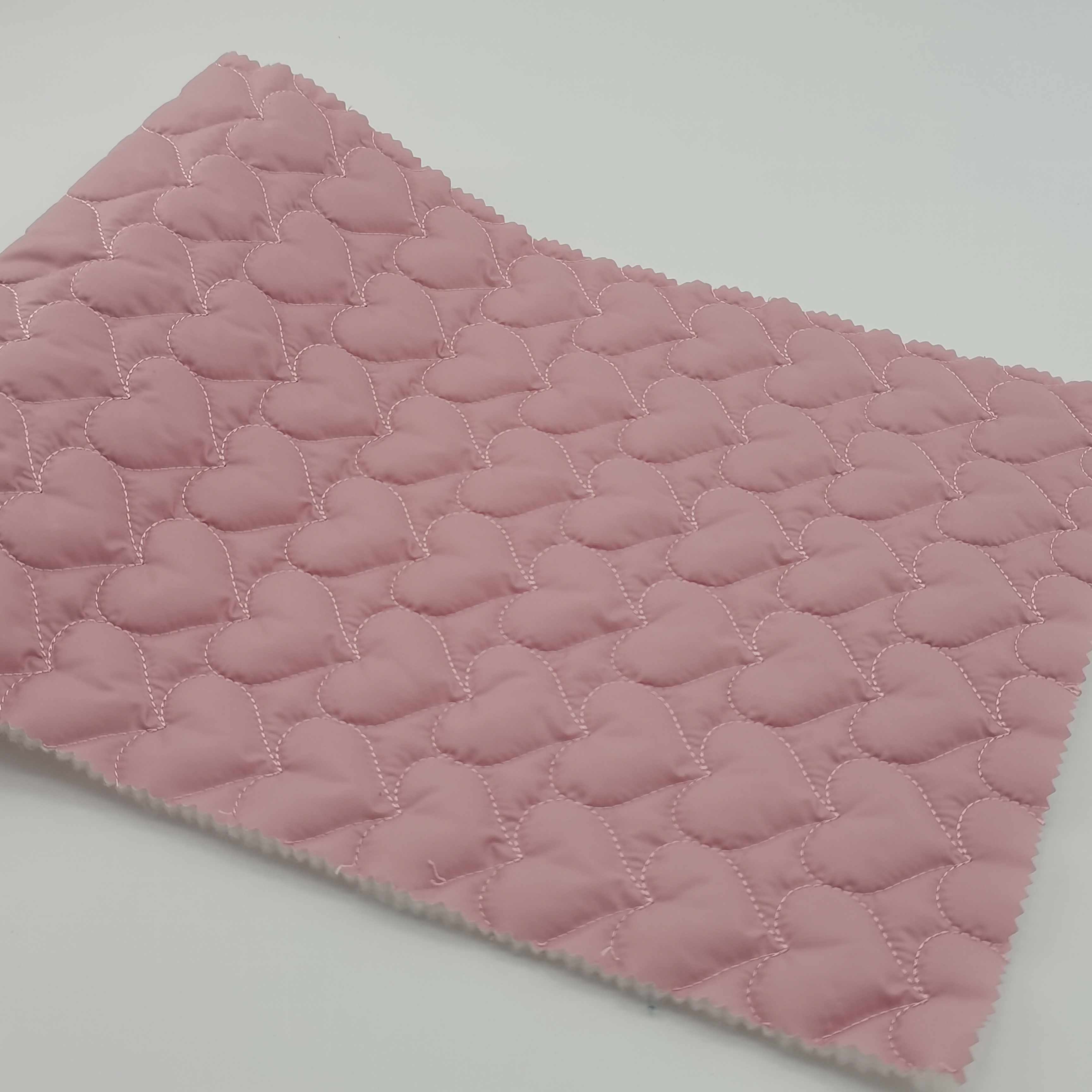 Low MOQ 300 meters 100% polyester pongee 140g padding quilted heart fabric for coat