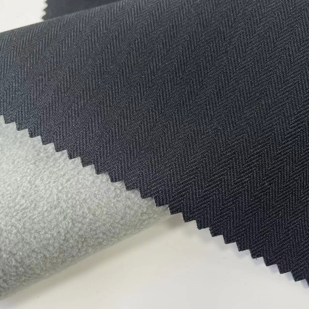 High Quality Breathable Waterproof TPU Coated 100% Polyester 300d Cationic Melange Herringbone Denim Fabric