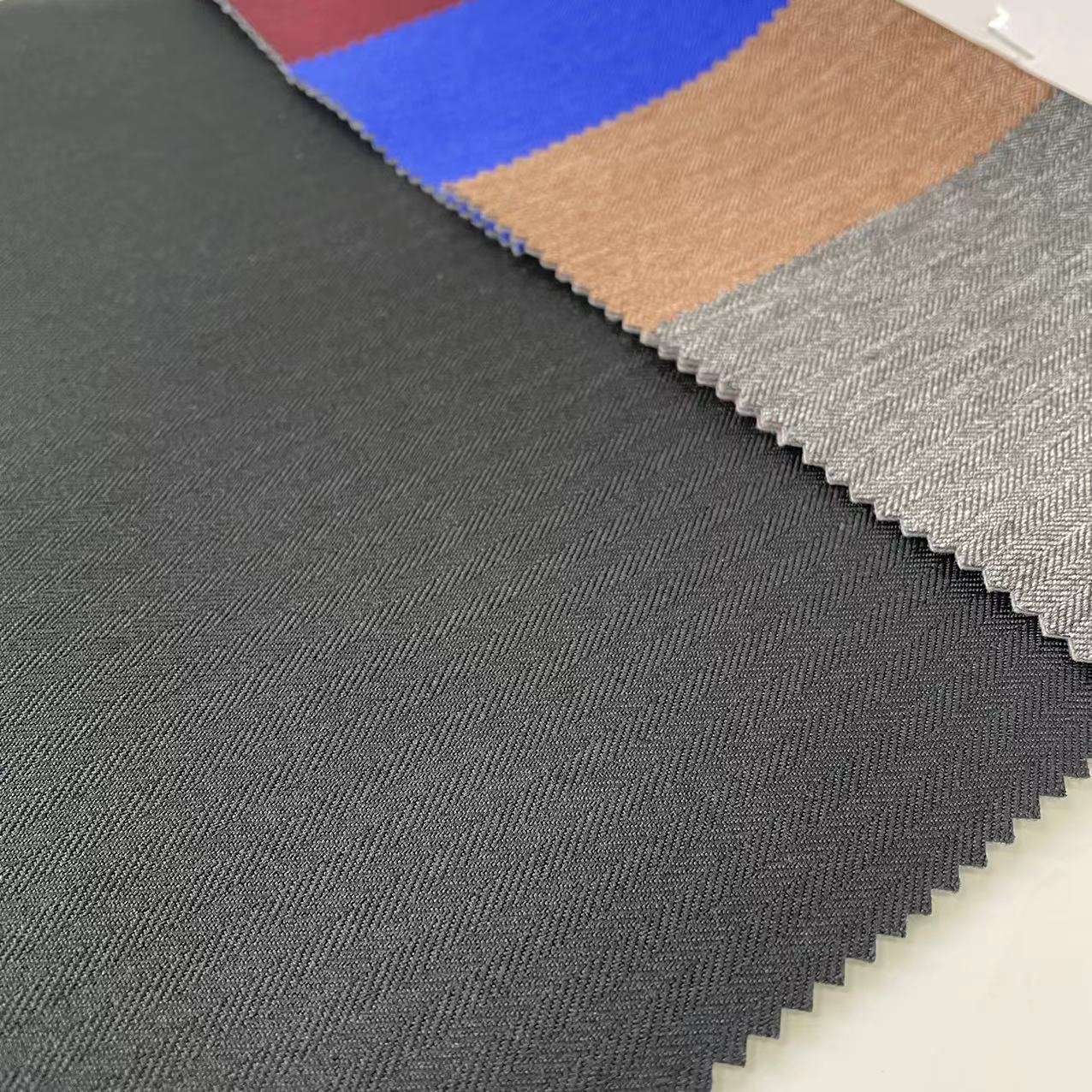 High Quality Breathable Waterproof TPU Coated 100% Polyester 300d Cationic Melange Herringbone Denim Fabric