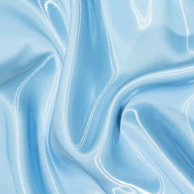 Hot sale wholesale satin shinny liquid soft silky polyester crystal Organza Fabric for blouses/dress