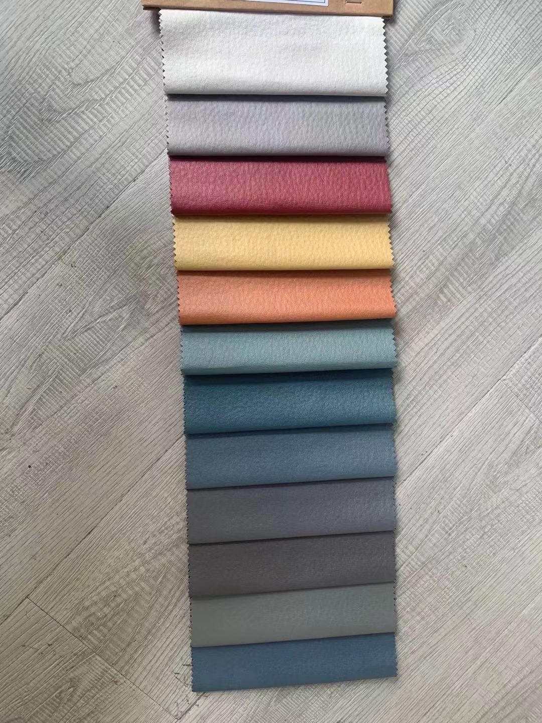 Latest 100% Polyester Synthetic Leather Fabric from China Manufacturer for Sofa Uplolstery and Home Textiles for Boys