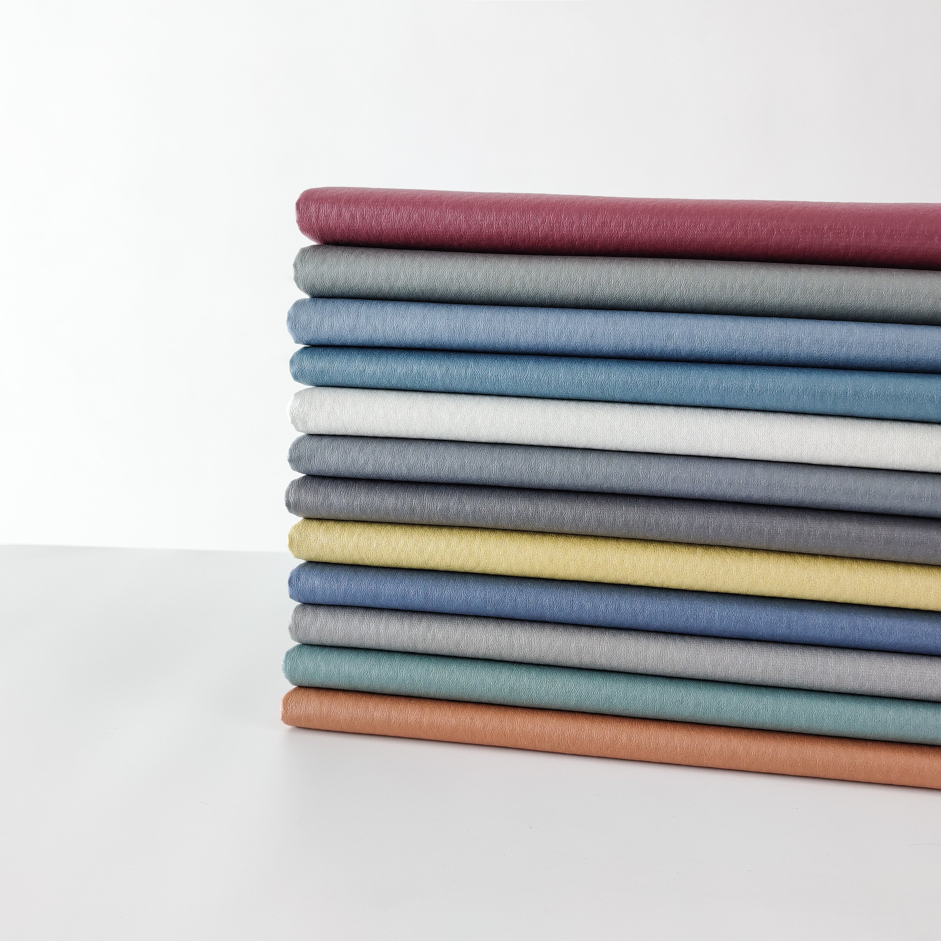 Latest 100% Polyester Synthetic Leather Fabric from China Manufacturer for Sofa Uplolstery and Home Textiles for Boys