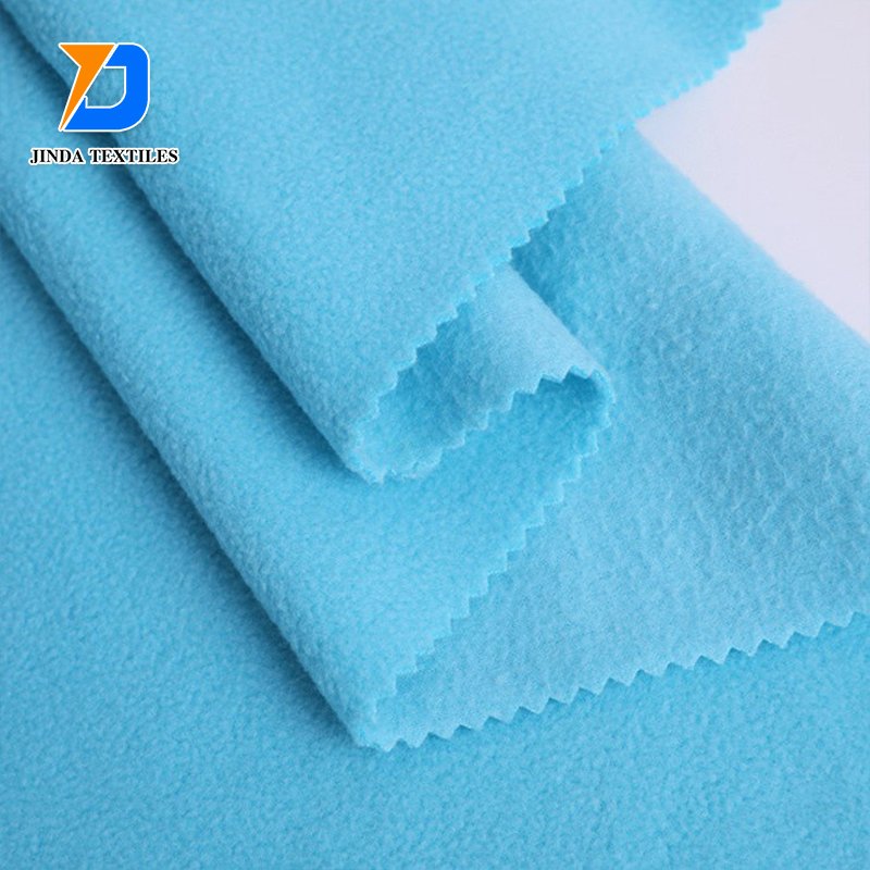 Jinda 100% polyester manufacture plain dyed flannel fleece fabric cotton flannel fabric