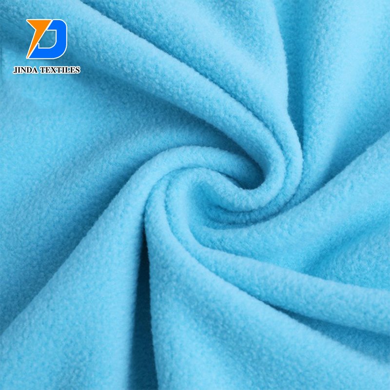 Jinda 100% polyester manufacture plain dyed flannel fleece fabric cotton flannel fabric