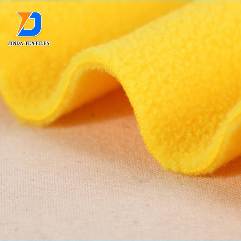 Jinda 100% polyester manufacture plain dyed flannel fleece fabric cotton flannel fabric