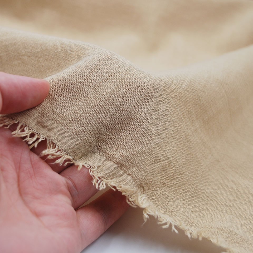 Low wholesale price soft solid slub pure color 100% polyester stone washed fake linen fabric