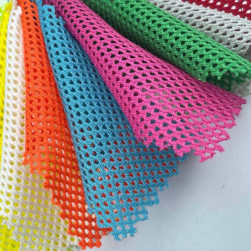 Wholesale garment knitted 100% polyester fiber 110g plain hole mesh fabric for vest decoration /ball wear