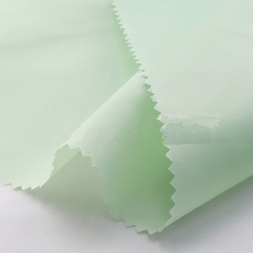 Suzhou Meidao stock lot fabric twill taffeta 100% polyester fabric lining fabrics for Suits windbreakers leather suits