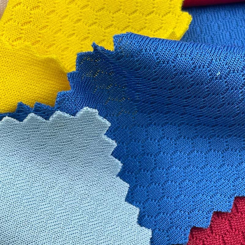 Hot sales moisture absorbing 75D honeycomb texture 100 polyester 150g basketball mesh single jersey fabric