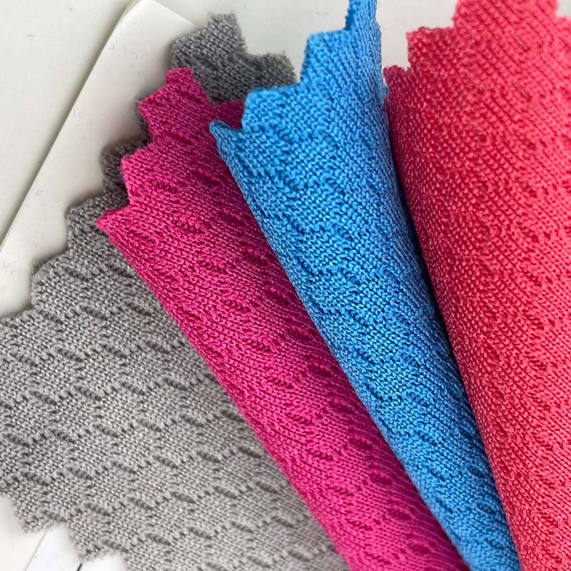 Hot sales moisture absorbing 75D honeycomb texture 100 polyester 150g basketball mesh single jersey fabric