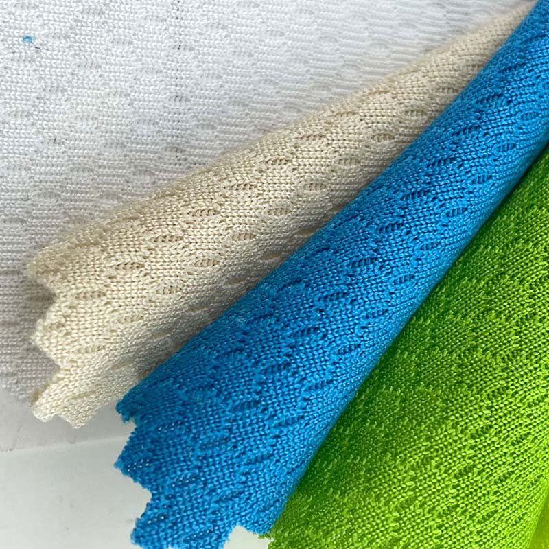 Hot sales moisture absorbing 75D honeycomb texture 100 polyester 150g basketball mesh single jersey fabric