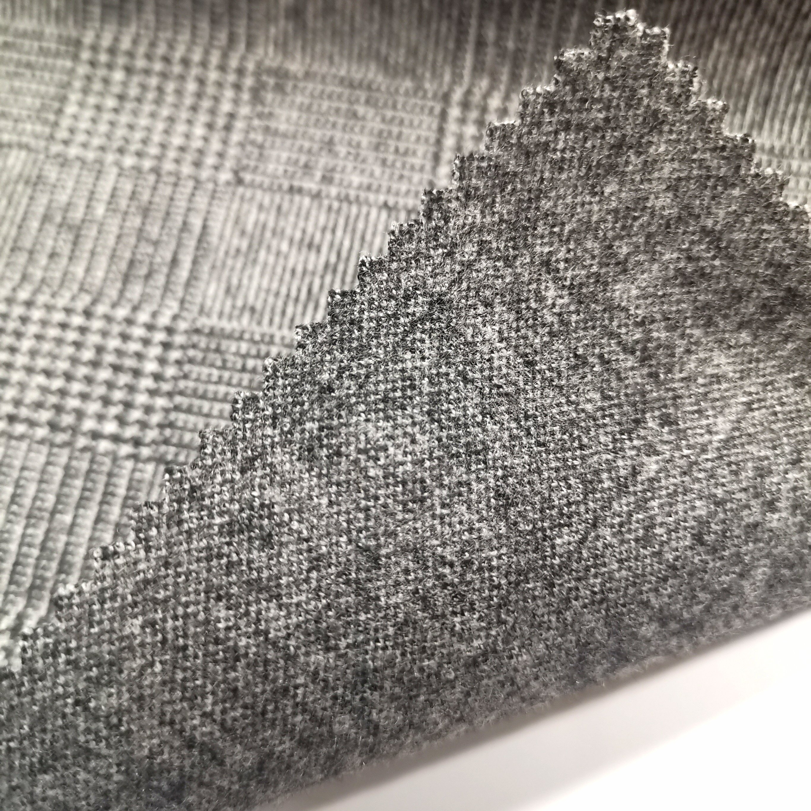 100%Polyester lint brush knit jacquard fabric yarn dye prickle finishing knit fabric for garment coat jacket