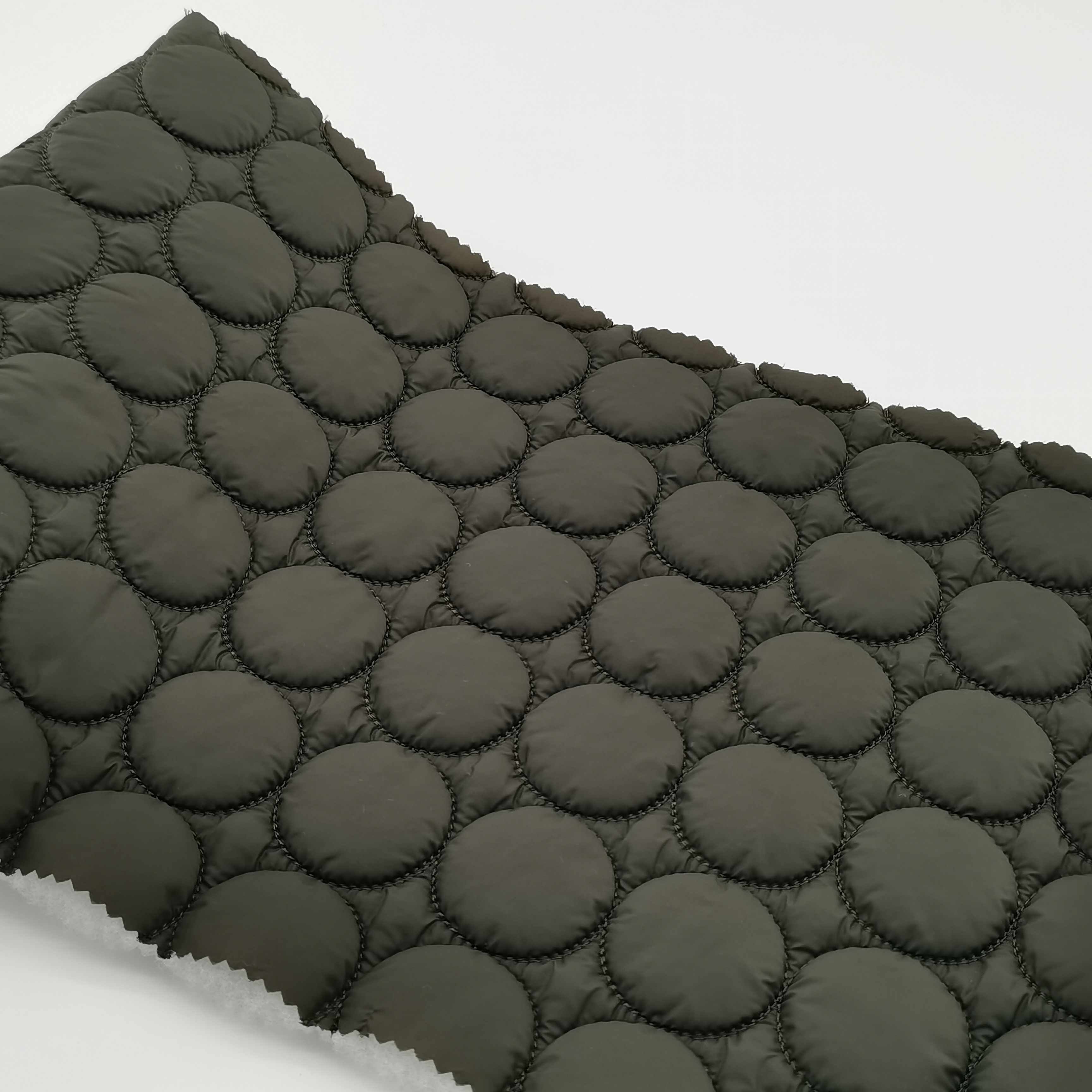Competitive price green color cirde design ultrasonic quilted nylon fabric for light coat