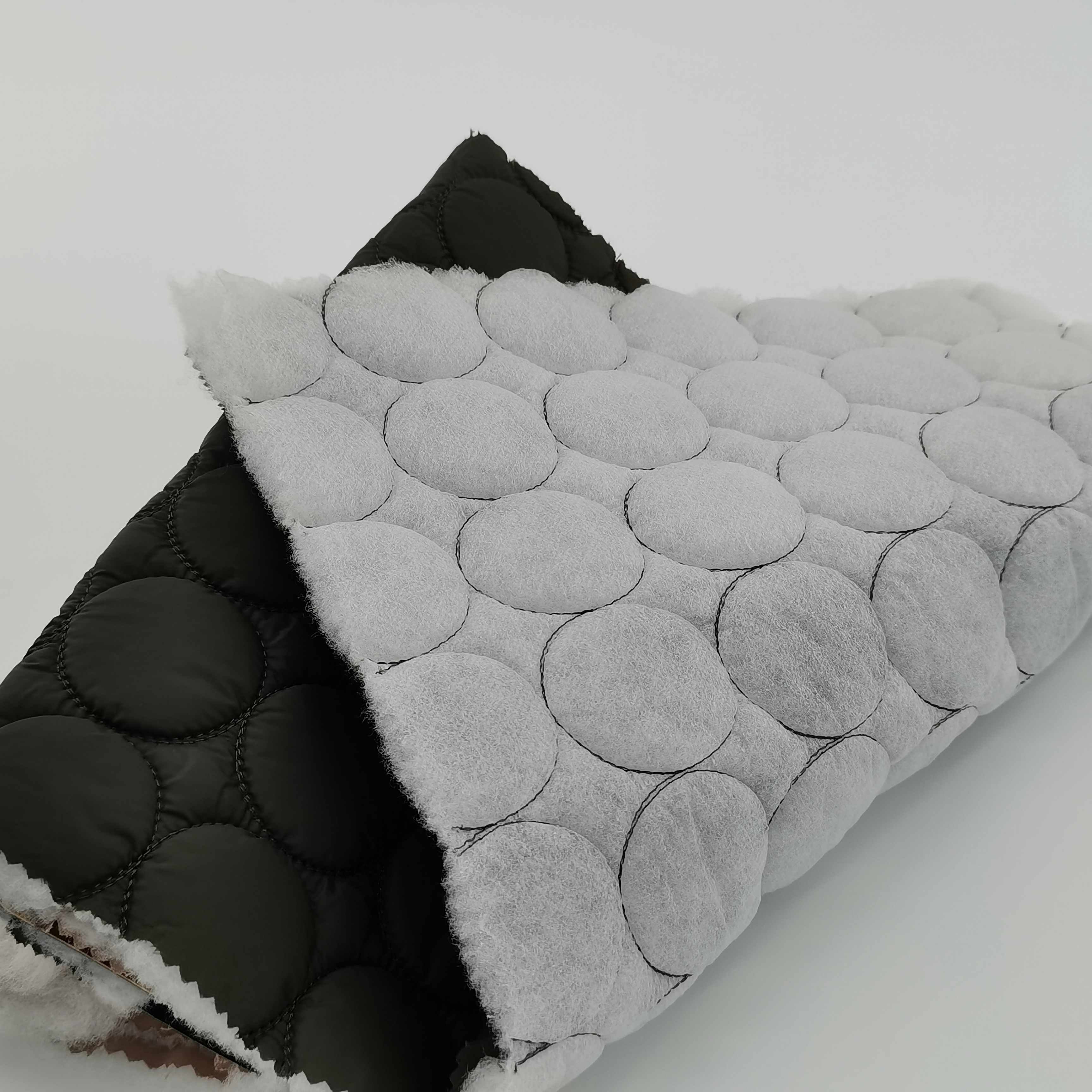 Competitive price green color cirde design ultrasonic quilted nylon fabric for light coat