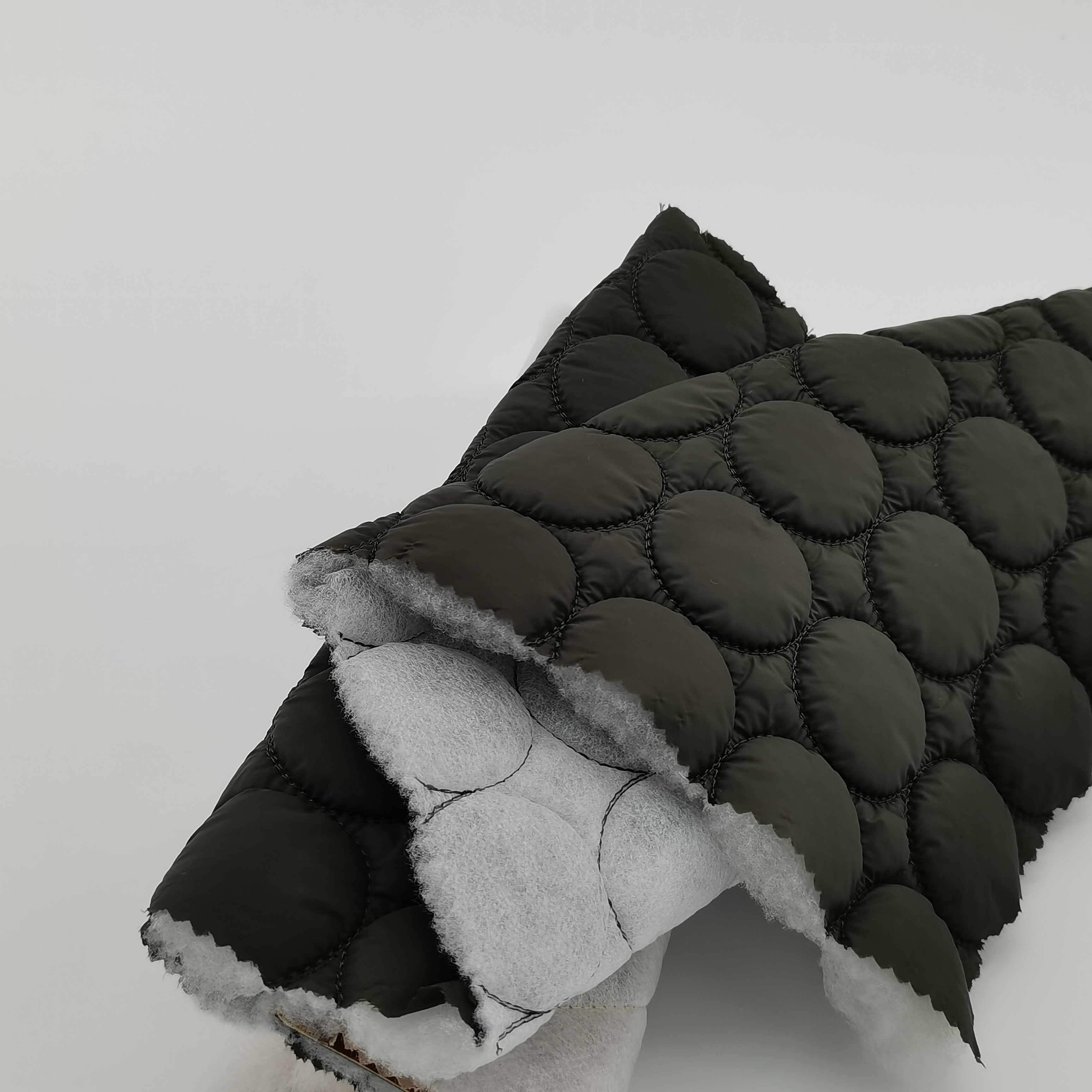 Competitive price green color cirde design ultrasonic quilted nylon fabric for light coat