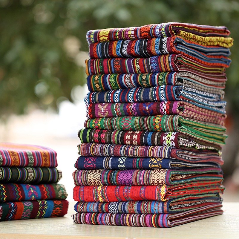 Wholesale of 100% polyester linen thickened ethnic style printed fabric DIY hand sewn shawl bags Pillows Tablecloths decorations