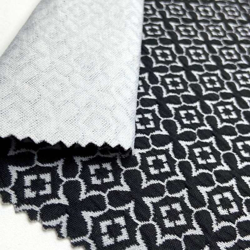 Four leaf clover pattern 97% polyester 3% spandex custom knit black white 270GSM jacquard fabric for jacket