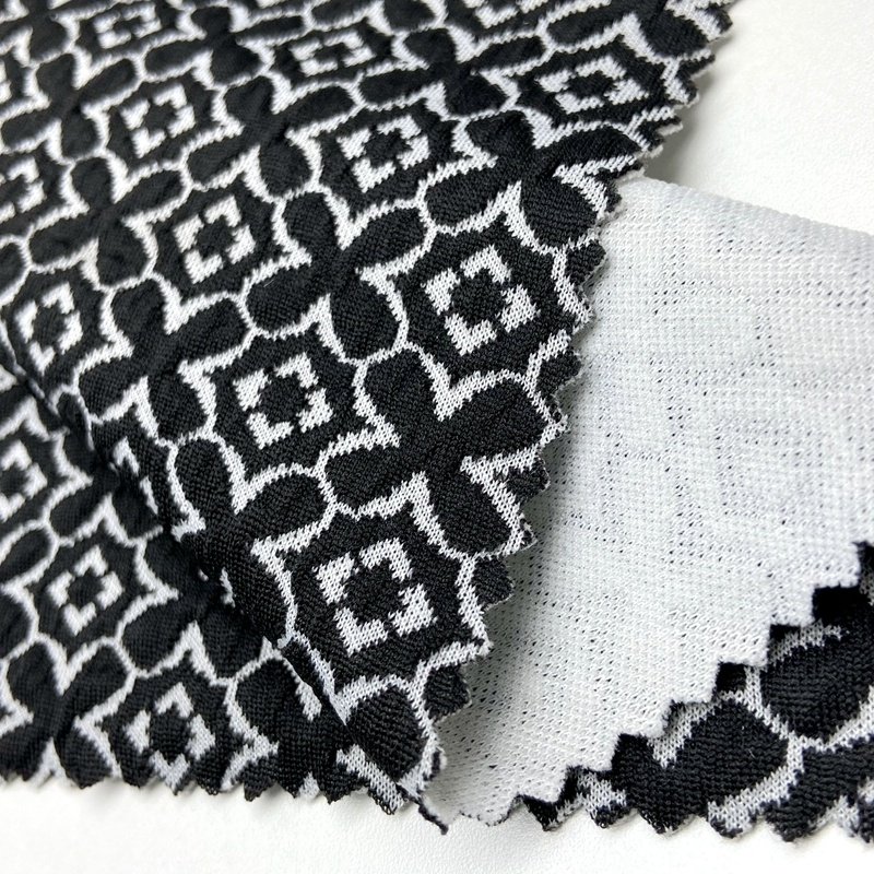 Four leaf clover pattern 97% polyester 3% spandex custom knit black white 270GSM jacquard fabric for jacket
