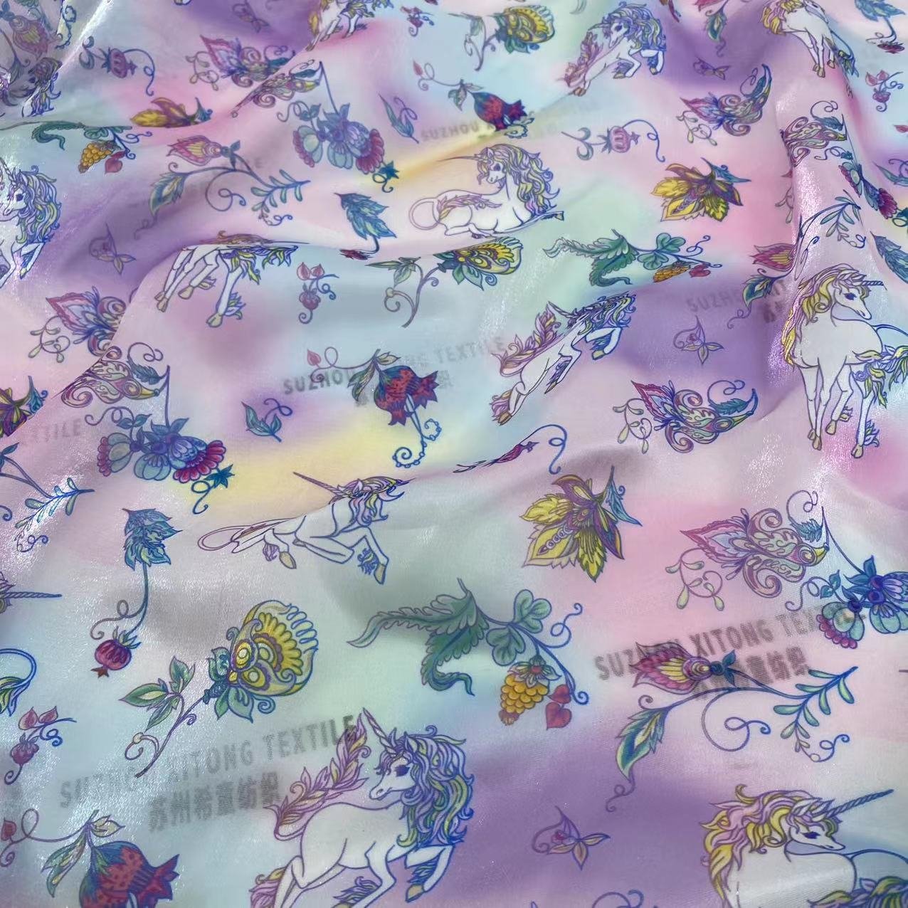 Hot selling polyester soft shiny cute design rainbow background liquid organza fabric for kids dress