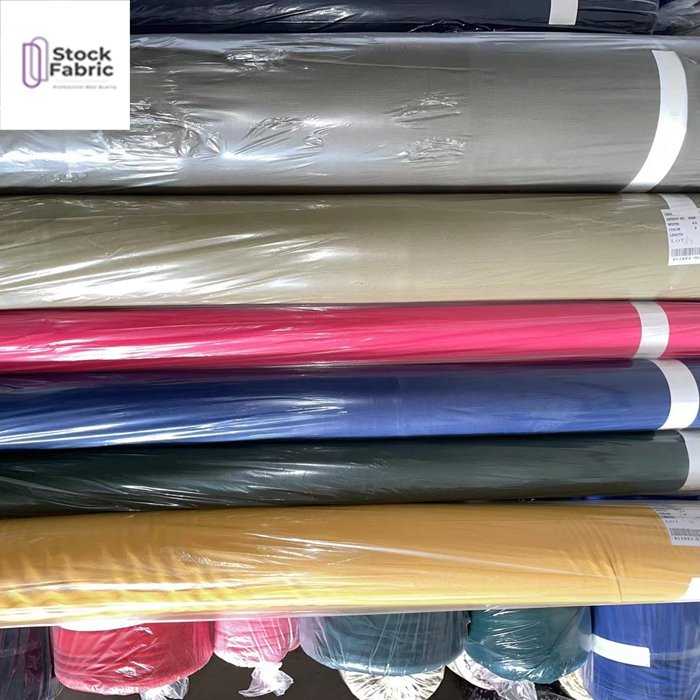 Free samples reliable quality woven stock lot 100% polyester bubble plain dyed fabric for garment