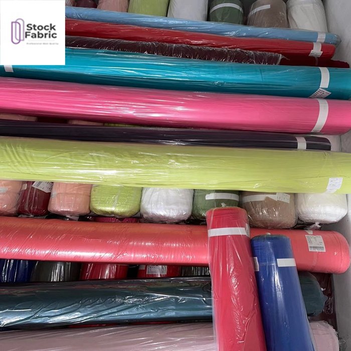 Free samples reliable quality woven stock lot 100% polyester bubble plain dyed fabric for garment