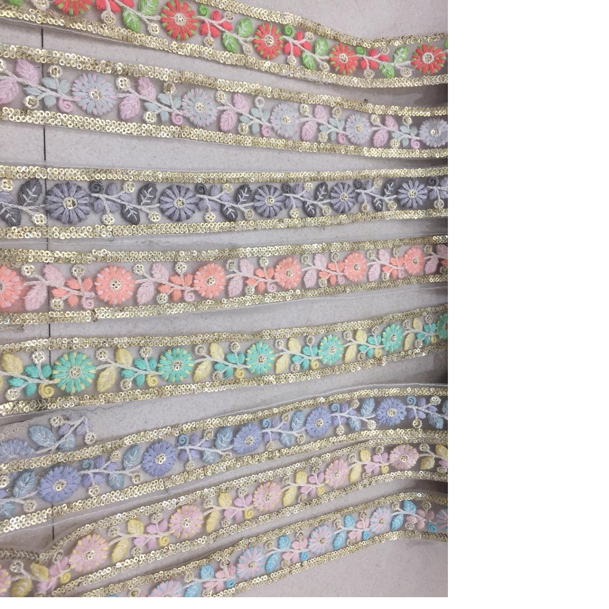 floral embroidered laces in beautiful pastel colors suitable for garments and apparel