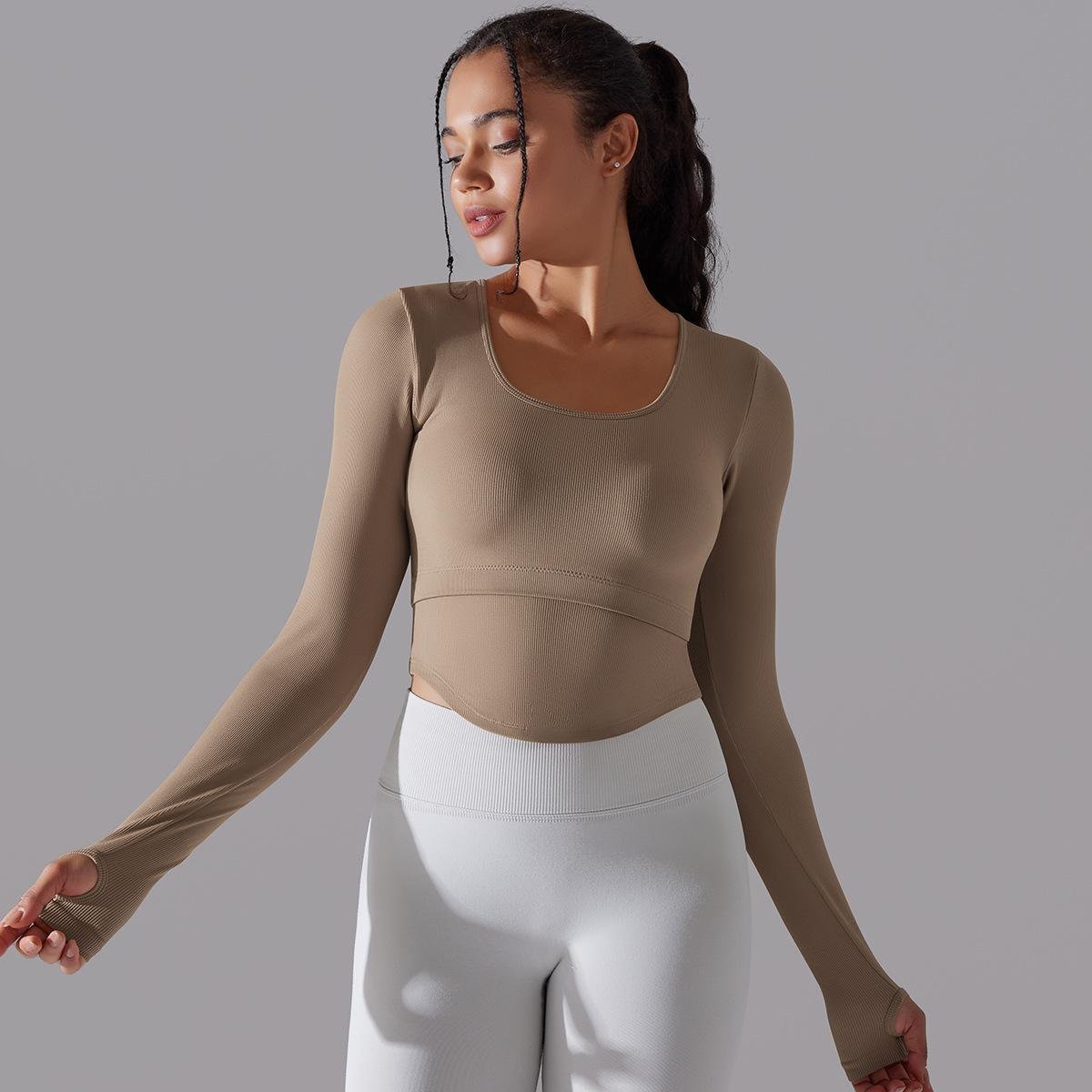 New Arrival Seamless Knitted Solid Color Split Hollow Ribbed Sports Yoga Long-sleeved With Chest Pad Fitness Crop Top For Women