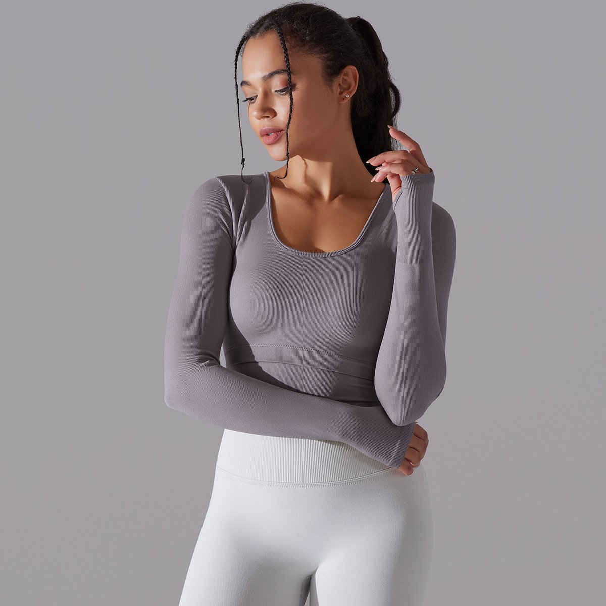 New Arrival Seamless Knitted Solid Color Split Hollow Ribbed Sports Yoga Long-sleeved With Chest Pad Fitness Crop Top For Women